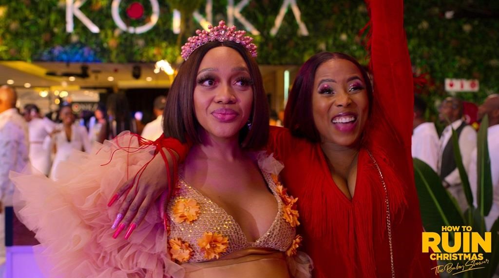 Beauty and Zama in How to Ruin Christmas The Baby Shower